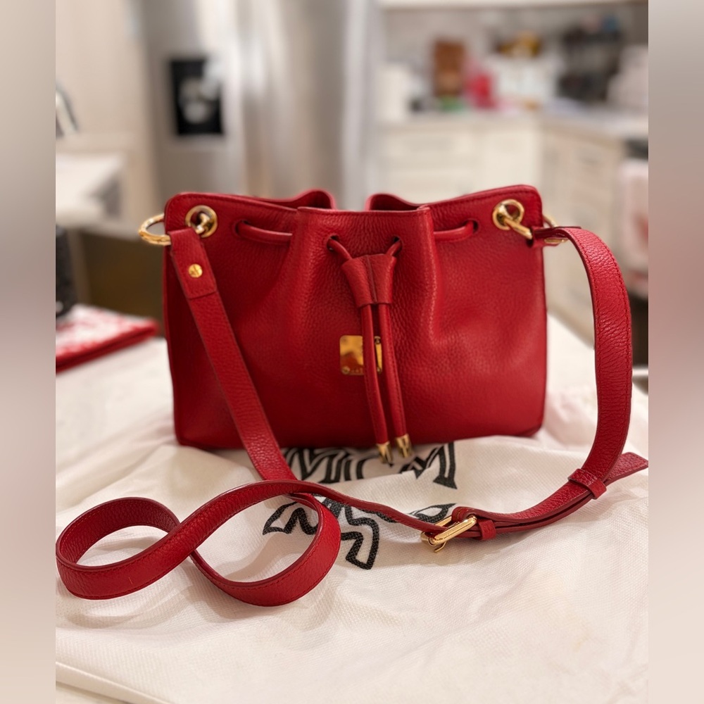 MCM Red Leather Bucket Bag
Crossbody Drawstring Gold Hardware - Picture 3 of 17